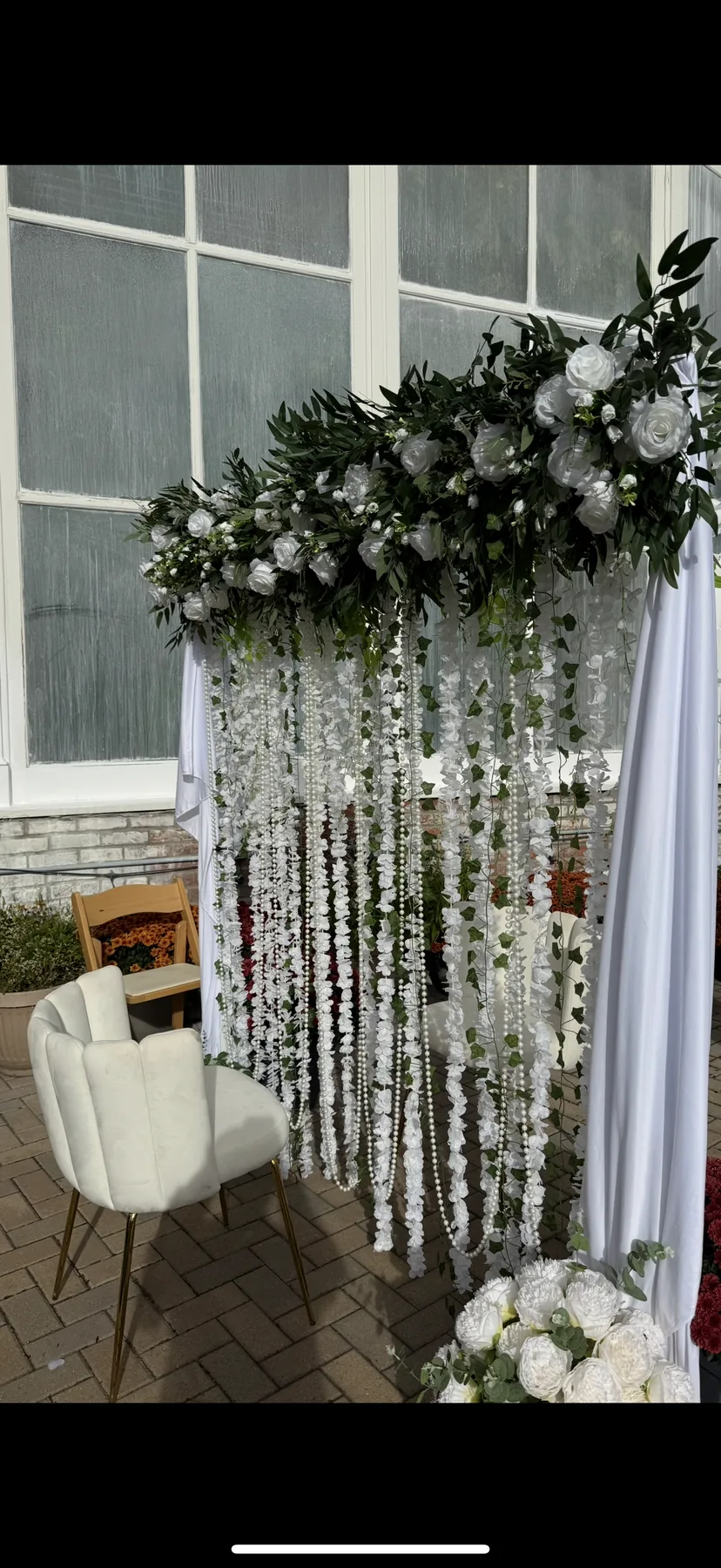 Elegant Buffalo wedding backdrop decor with floral accents by WNY Decor.